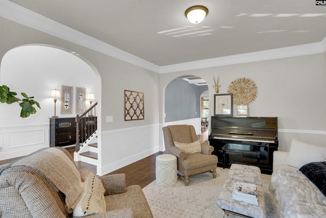 living room featuring hardwood / wood-style flooring and ornamental molding