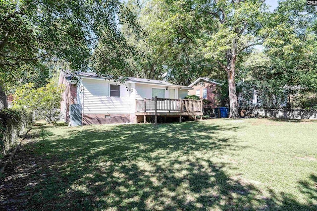 view of yard with a deck