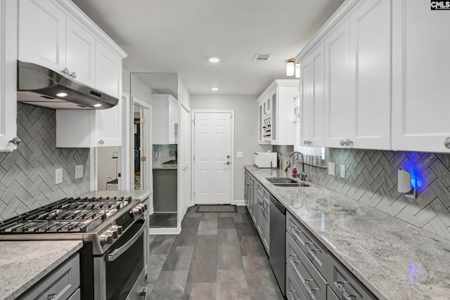 kitchen with white cabinetry, appliances with stainless steel finishes, and sink