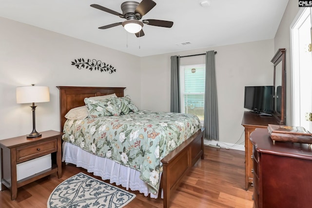 bedroom featuring hardwood / wood-style floors and ceiling fan