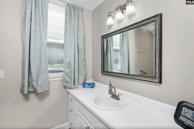 bathroom with vanity and a healthy amount of sunlight