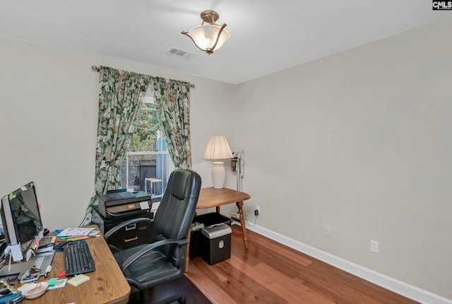 office area with hardwood / wood-style flooring