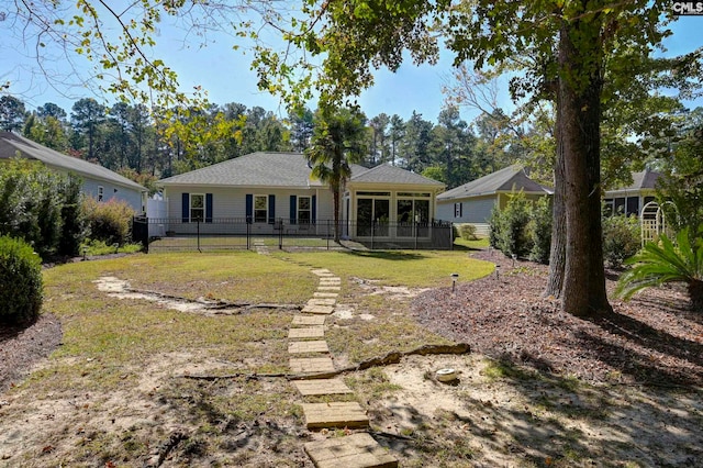 back of house with a yard