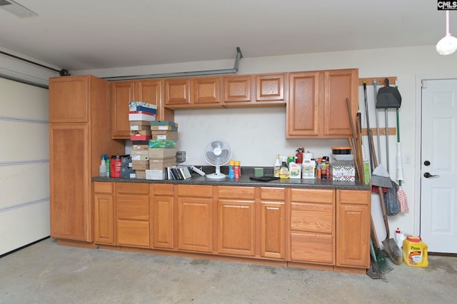 kitchen with dark stone countertops