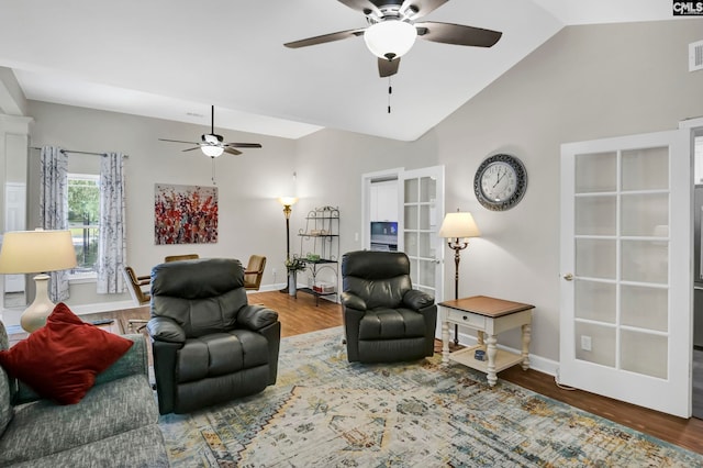 living room featuring french doors, ceiling fan, hardwood / wood-style flooring, and lofted ceiling