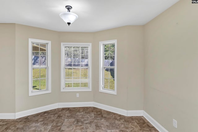 spare room with plenty of natural light