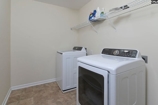 washroom featuring washing machine and dryer