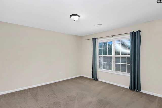 empty room with carpet flooring