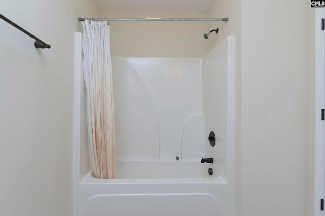 bathroom with shower / bath combination with curtain