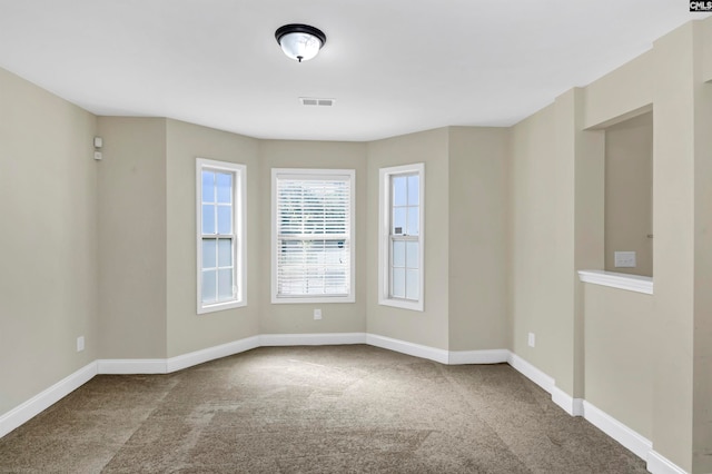 unfurnished room featuring carpet flooring