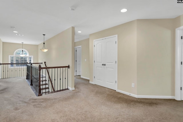 hallway featuring carpet