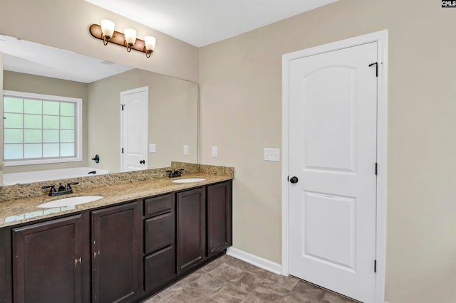 bathroom with vanity and a tub to relax in