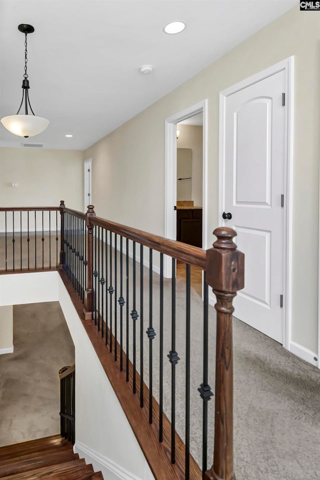 hallway featuring carpet floors