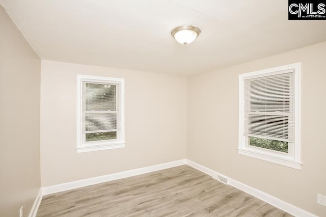 spare room with light wood-type flooring