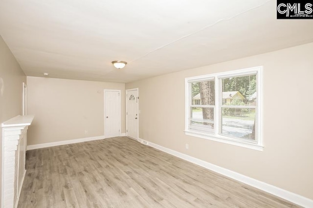 unfurnished living room featuring light hardwood / wood-style flooring