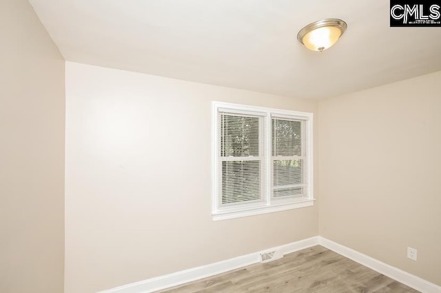 spare room featuring light wood-type flooring