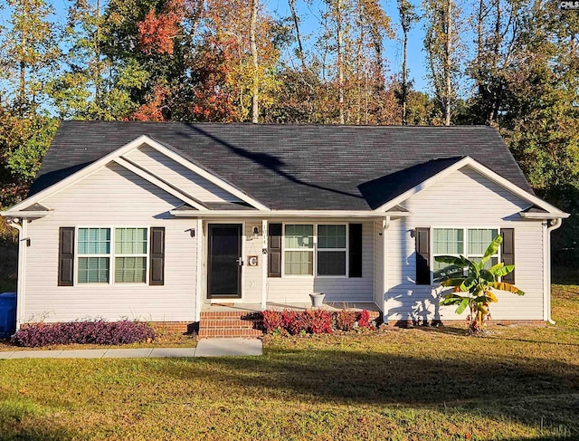 ranch-style home with a front yard