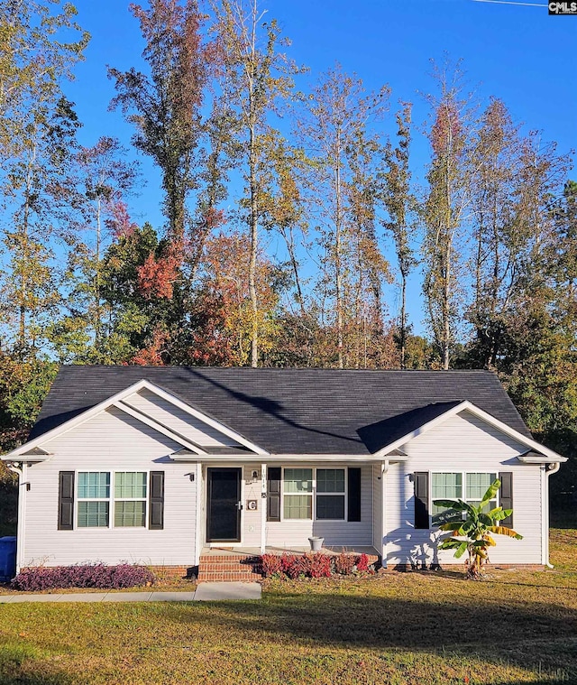 ranch-style home with a front yard