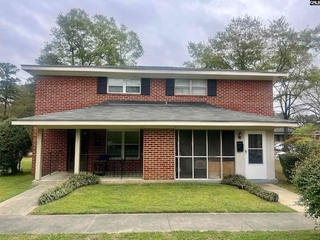 view of front of house featuring a porch and a front yard