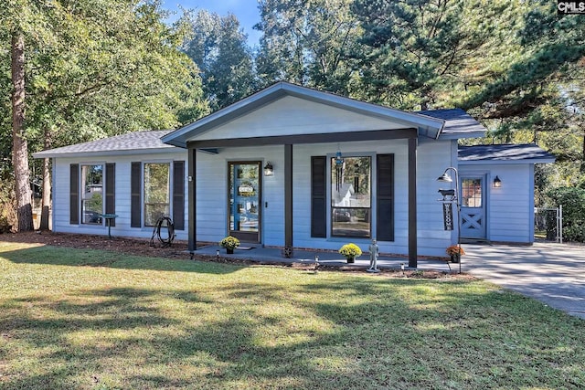 view of front of house with a front yard and a porch