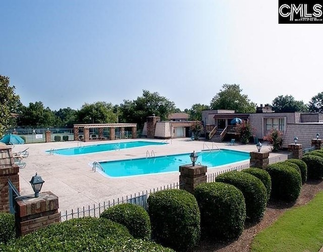 view of swimming pool with a patio area