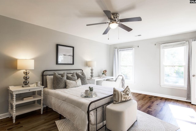 bedroom featuring dark hardwood / wood-style floors and ceiling fan