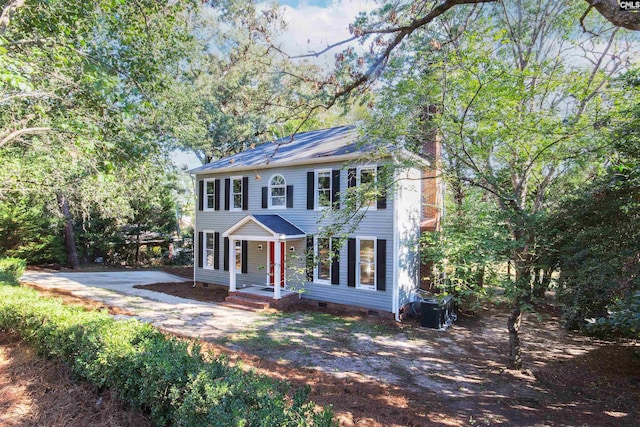 colonial-style house with cooling unit