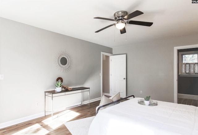 bedroom featuring wood-type flooring and ceiling fan