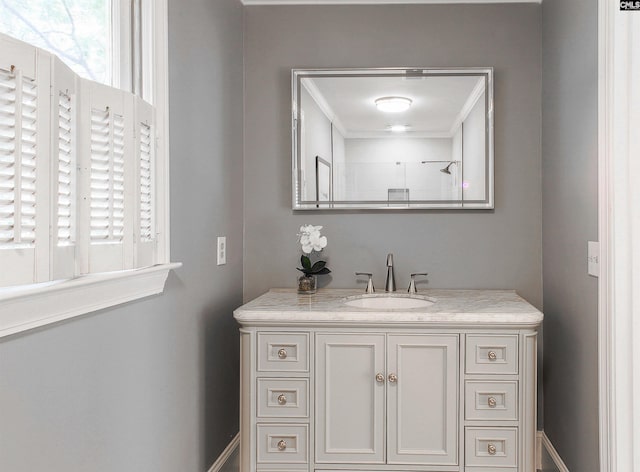 bathroom featuring vanity and ornamental molding