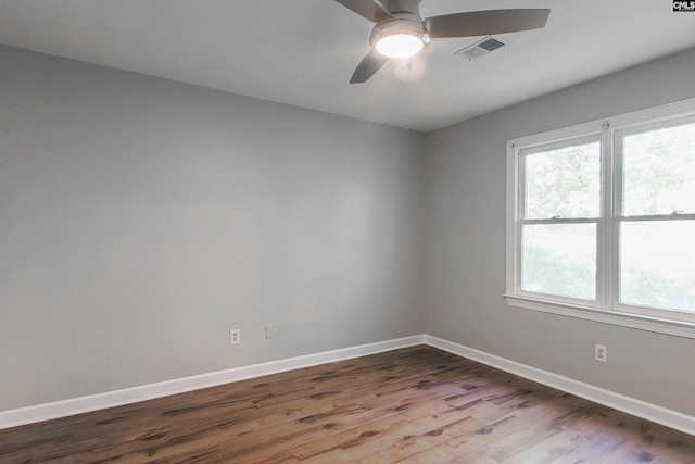 spare room featuring hardwood / wood-style flooring and ceiling fan