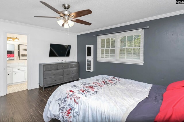 bedroom with dark wood-type flooring, ensuite bath, ornamental molding, a textured ceiling, and ceiling fan