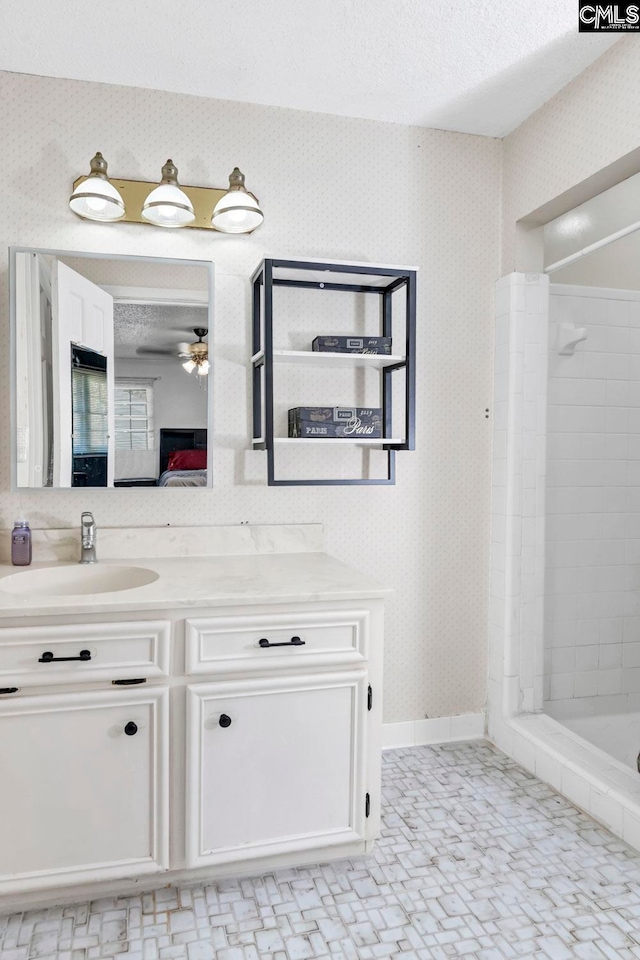 bathroom with vanity, a textured ceiling, independent shower and bath, and ceiling fan