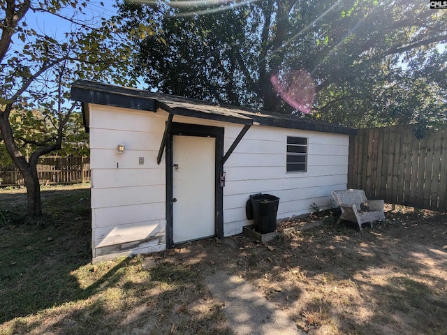 view of shed with fence