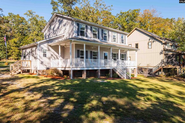 view of front facade with covered porch and a front lawn