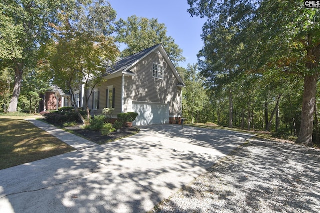 view of side of home with a garage