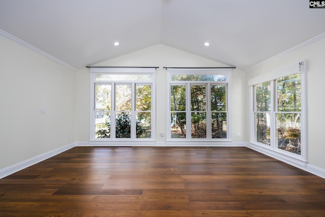 empty room featuring ornamental molding, dark hardwood / wood-style floors, and a healthy amount of sunlight