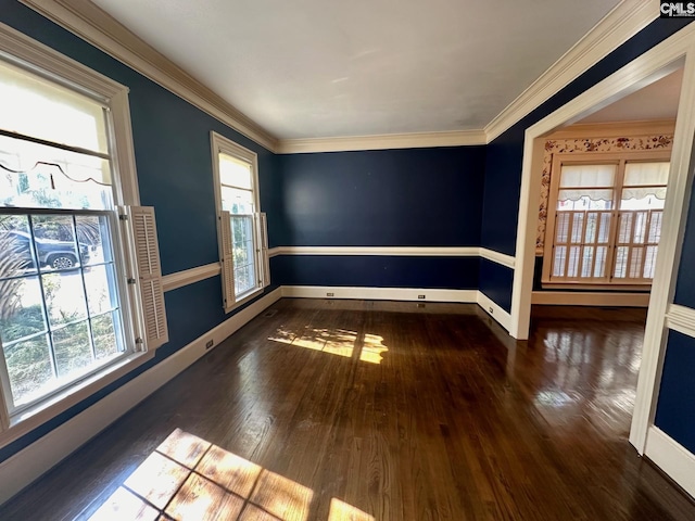 unfurnished room with crown molding, dark wood-type flooring, and a wealth of natural light