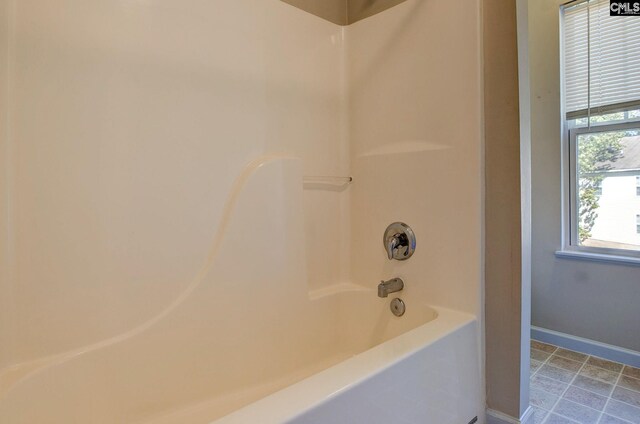 bathroom with shower / washtub combination