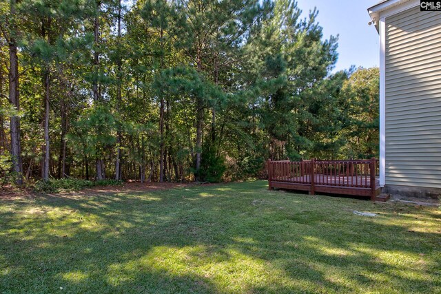 view of yard featuring a deck