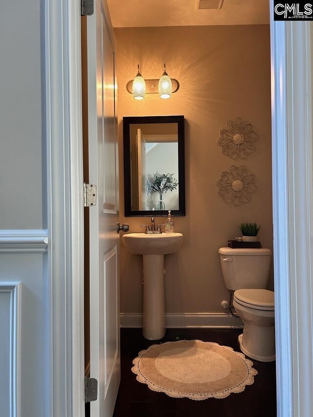 60 Fork Branch Ct, Irmo, SC 29063 - bathroom featuring visible vents, baseboards, a sink, and toilet