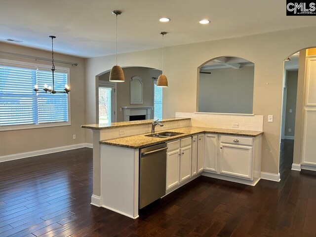 60 Fork Branch Ct, Irmo, SC 29063 - kitchen featuring light stone counters, visible vents, stainless steel dishwasher, a sink, and decorative backsplash