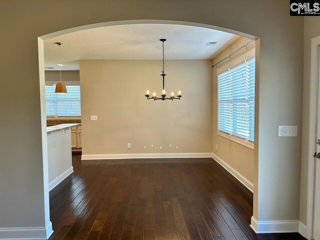 60 Fork Branch Ct, Irmo, SC 29063 - unfurnished dining area with baseboards, arched walkways, dark wood-style floors, and an inviting chandelier
