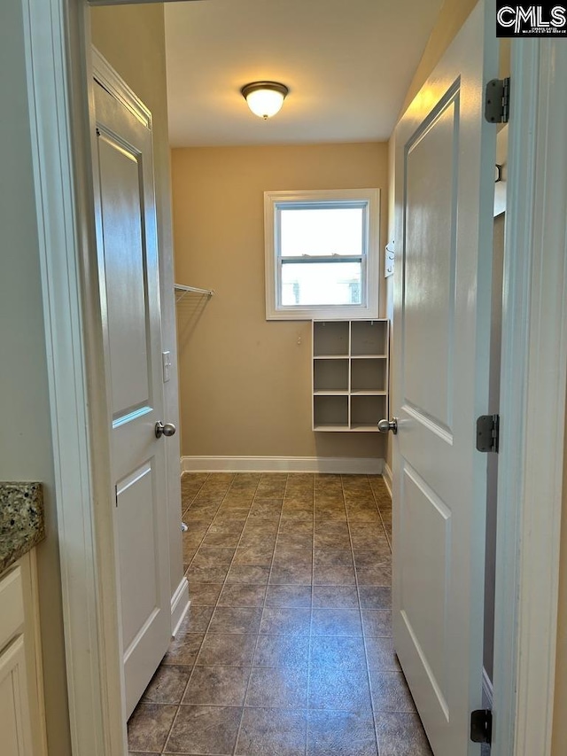 interior space featuring dark tile patterned floors