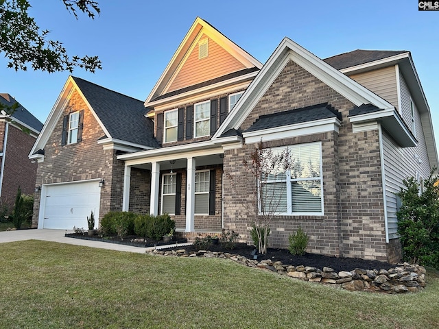 craftsman-style house featuring a front yard and a garage