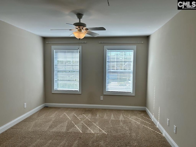 unfurnished room with carpet and ceiling fan