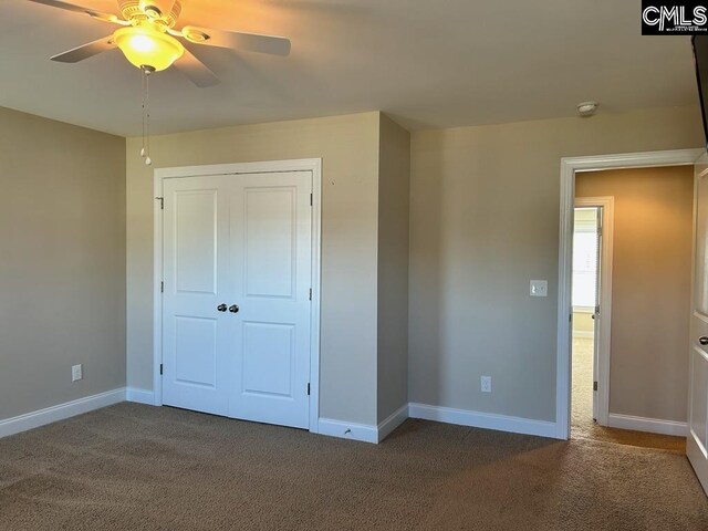 60 Fork Branch Ct, Irmo, SC 29063 - unfurnished bedroom featuring dark carpet, baseboards, a ceiling fan, and a closet