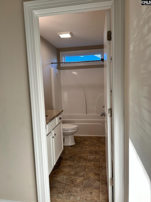 full bathroom featuring vanity, shower / bathing tub combination, and toilet