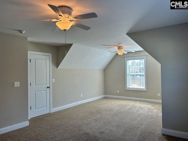 bonus room featuring light colored carpet, vaulted ceiling, and ceiling fan