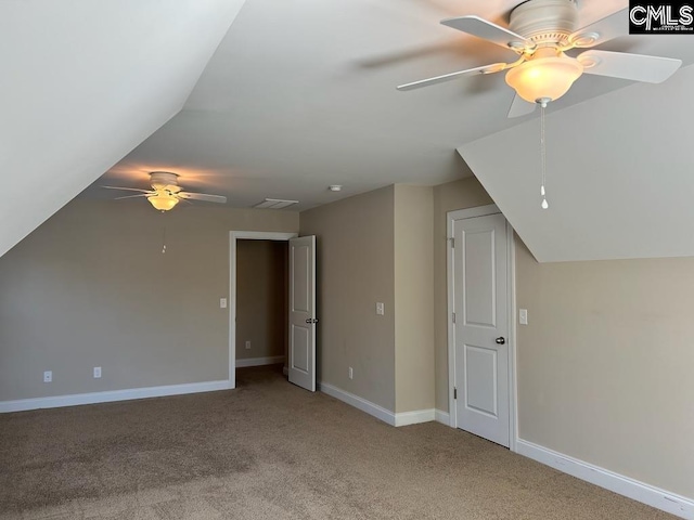 bonus room featuring vaulted ceiling, light colored carpet, and ceiling fan