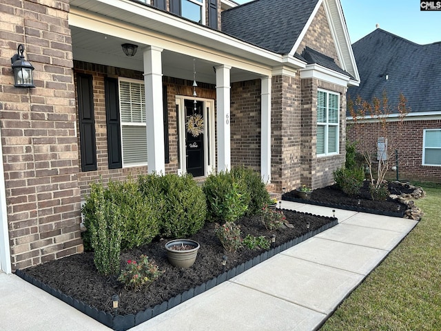 property entrance featuring a porch